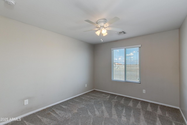 carpeted empty room featuring ceiling fan