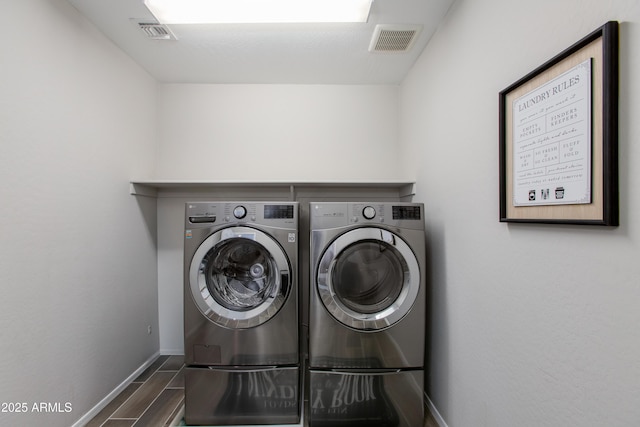 laundry area featuring separate washer and dryer