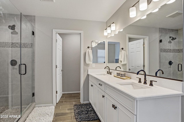 bathroom with vanity and an enclosed shower