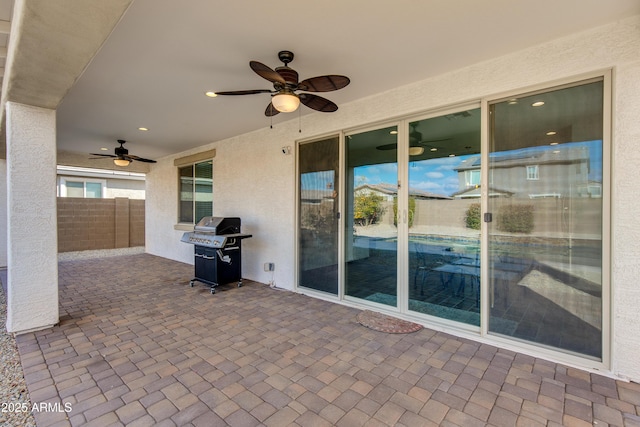 view of patio featuring grilling area and ceiling fan