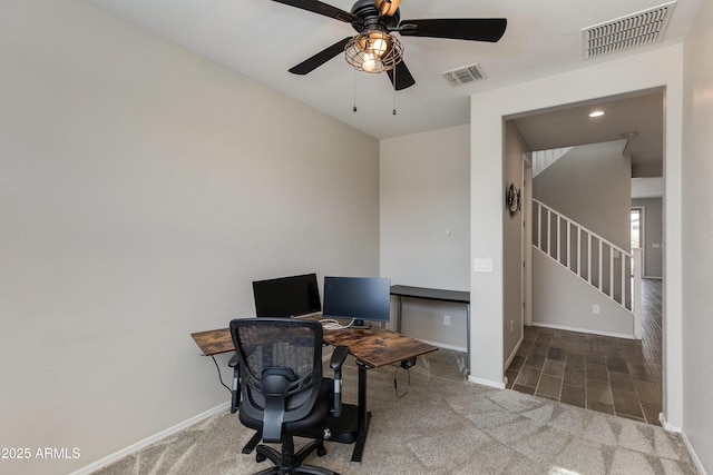 carpeted home office with ceiling fan