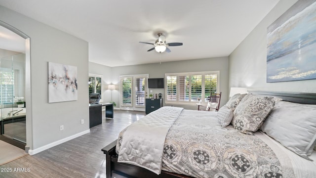 bedroom with access to outside, hardwood / wood-style floors, and ceiling fan