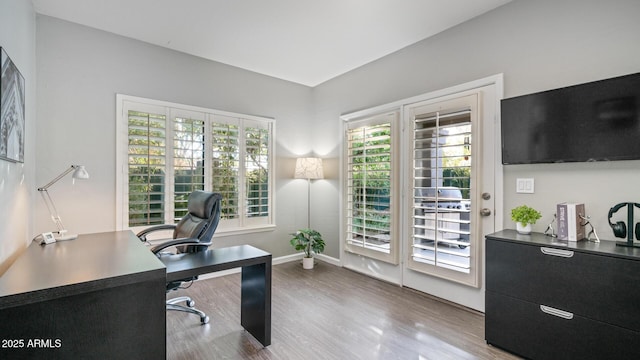 office with light hardwood / wood-style floors