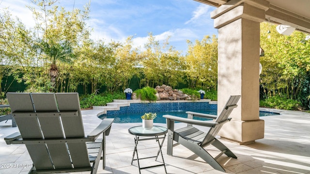 view of swimming pool with a patio area