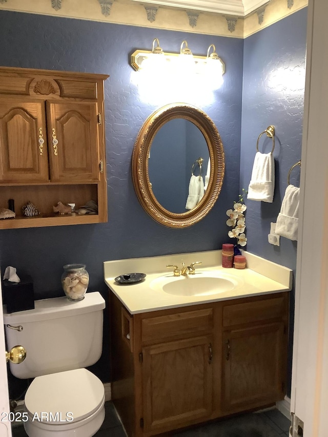 half bath featuring vanity and toilet