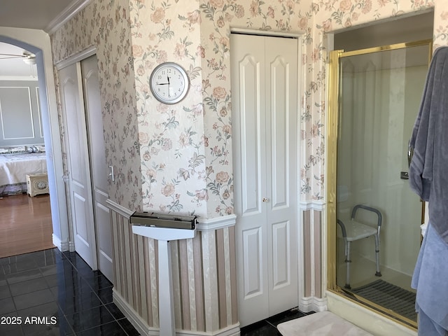 corridor featuring dark tile patterned floors and wallpapered walls