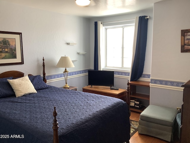 bedroom featuring wood finished floors