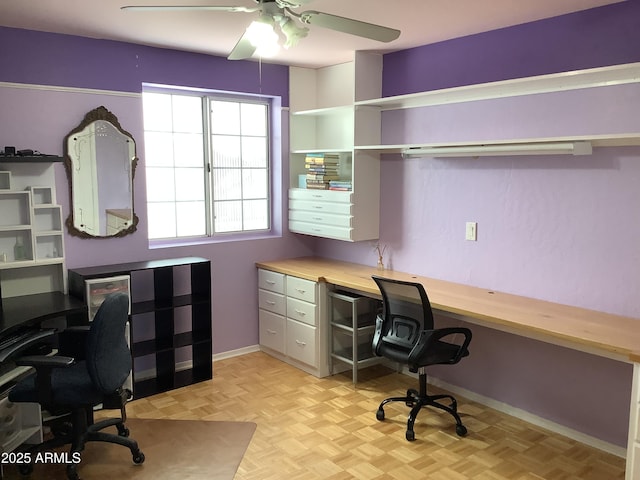 office featuring a ceiling fan and baseboards