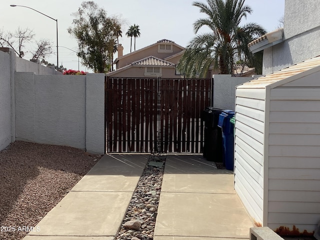 view of gate with fence