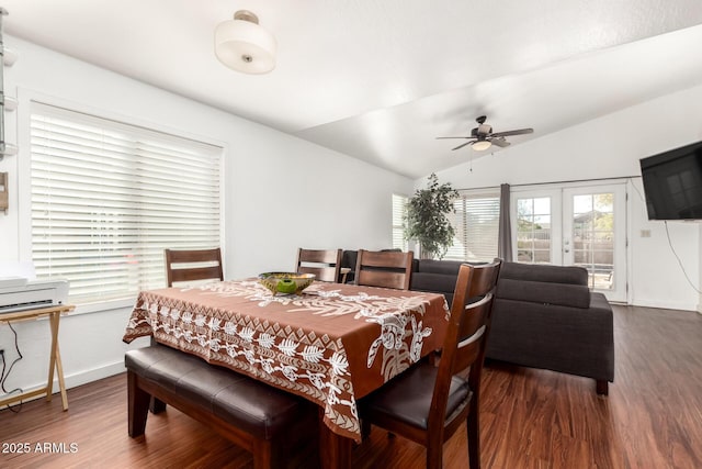 dining area with dark wood finished floors, french doors, vaulted ceiling, and baseboards