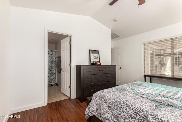 bedroom with baseboards, visible vents, dark wood finished floors, a ceiling fan, and lofted ceiling