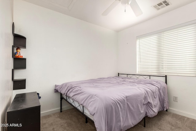 bedroom with a ceiling fan, light colored carpet, visible vents, and baseboards