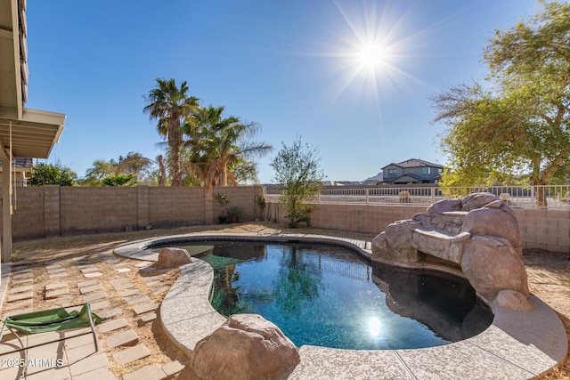 view of pool featuring a patio, a fenced backyard, and a fenced in pool