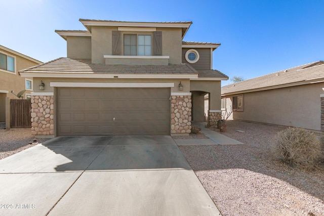 view of front of home featuring stucco siding, a garage, stone siding, driveway, and a tiled roof