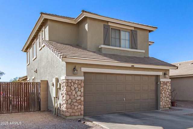 view of front of property with a garage, stone siding, driveway, and stucco siding