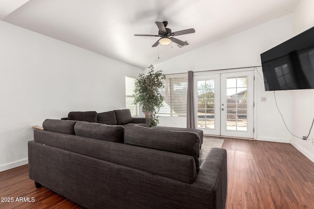 living area featuring lofted ceiling, baseboards, dark wood finished floors, and french doors