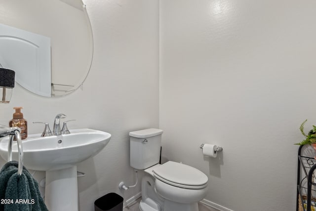 bathroom with sink and toilet