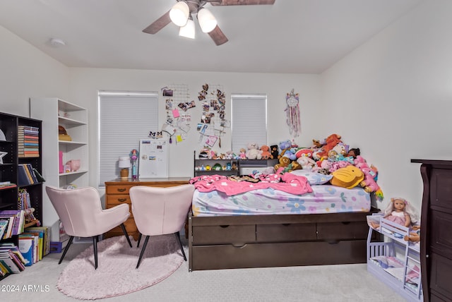 bedroom with ceiling fan and light colored carpet