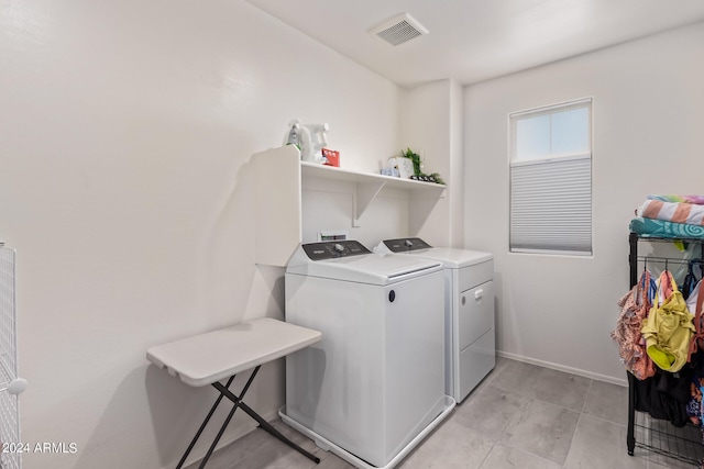 washroom with washer and dryer