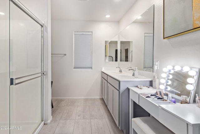 bathroom with vanity and an enclosed shower