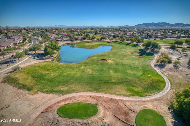 birds eye view of property with a water and mountain view