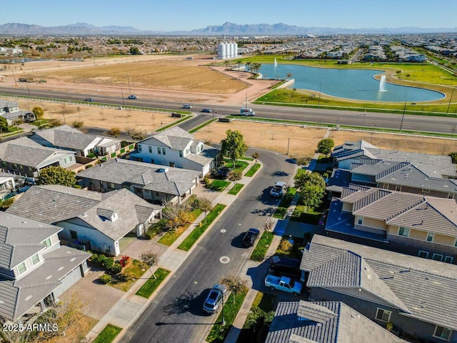 aerial view featuring a water and mountain view