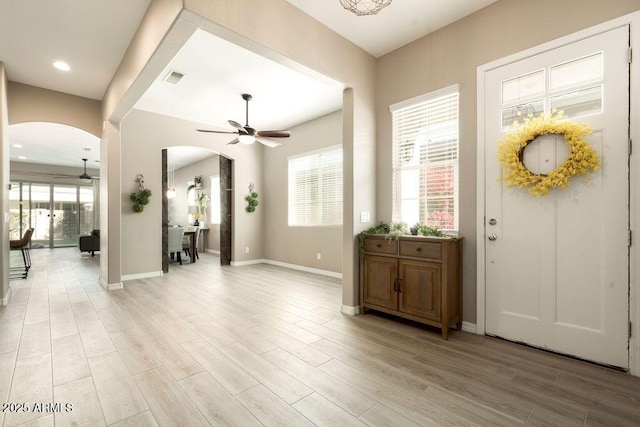 foyer featuring ceiling fan and light hardwood / wood-style flooring