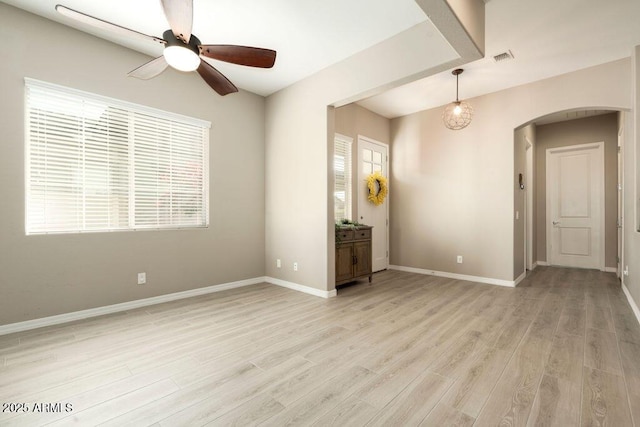 unfurnished room with ceiling fan and light hardwood / wood-style flooring