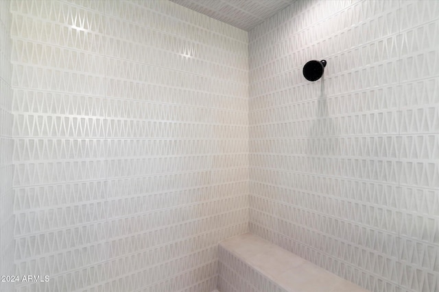 bathroom with tiled shower