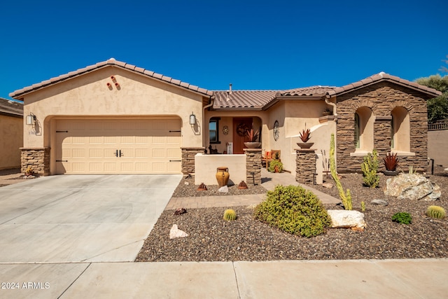 mediterranean / spanish-style house featuring a garage