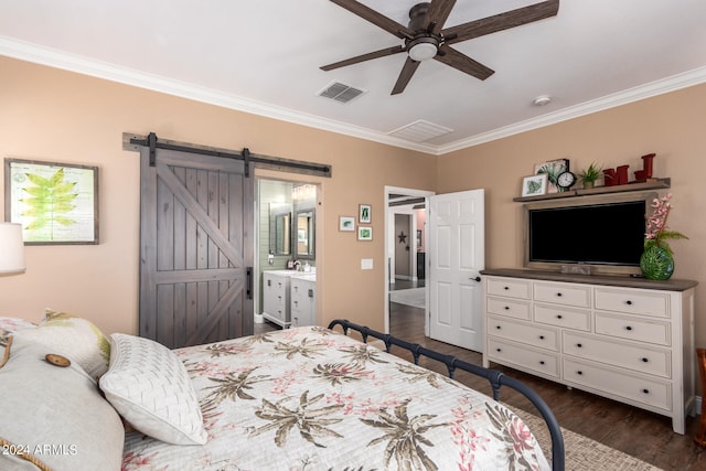 bedroom with sink, ornamental molding, dark hardwood / wood-style floors, ceiling fan, and a barn door