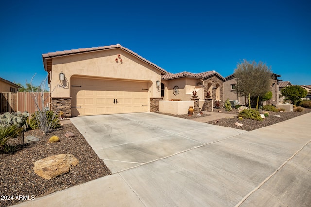 mediterranean / spanish-style home featuring a garage