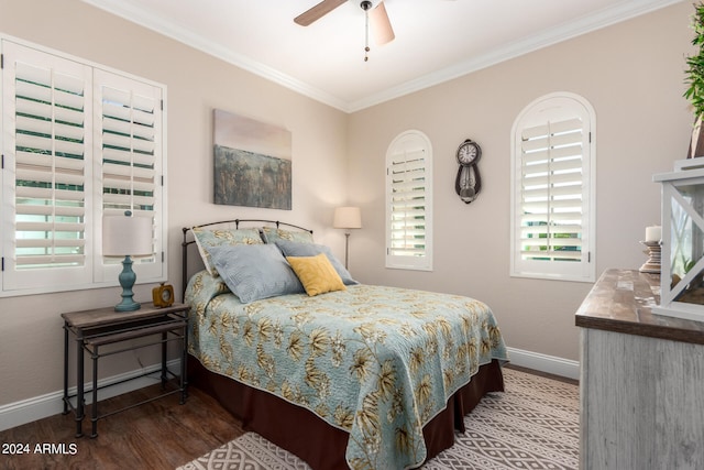 bedroom with crown molding, wood-type flooring, and ceiling fan