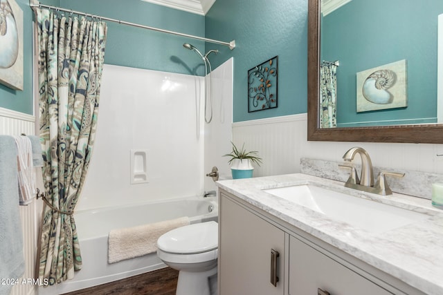 full bathroom featuring vanity, hardwood / wood-style floors, shower / bathtub combination with curtain, and toilet