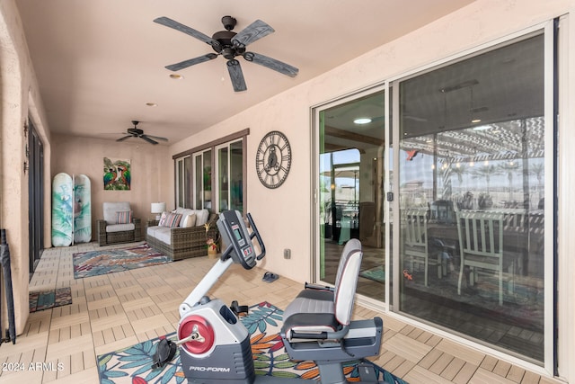 exterior space featuring outdoor lounge area and ceiling fan