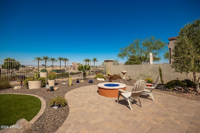 view of patio / terrace featuring an outdoor fire pit