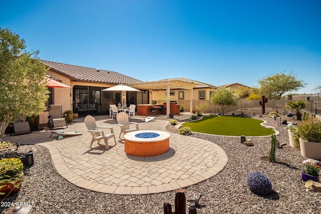 view of patio / terrace featuring an outdoor fire pit