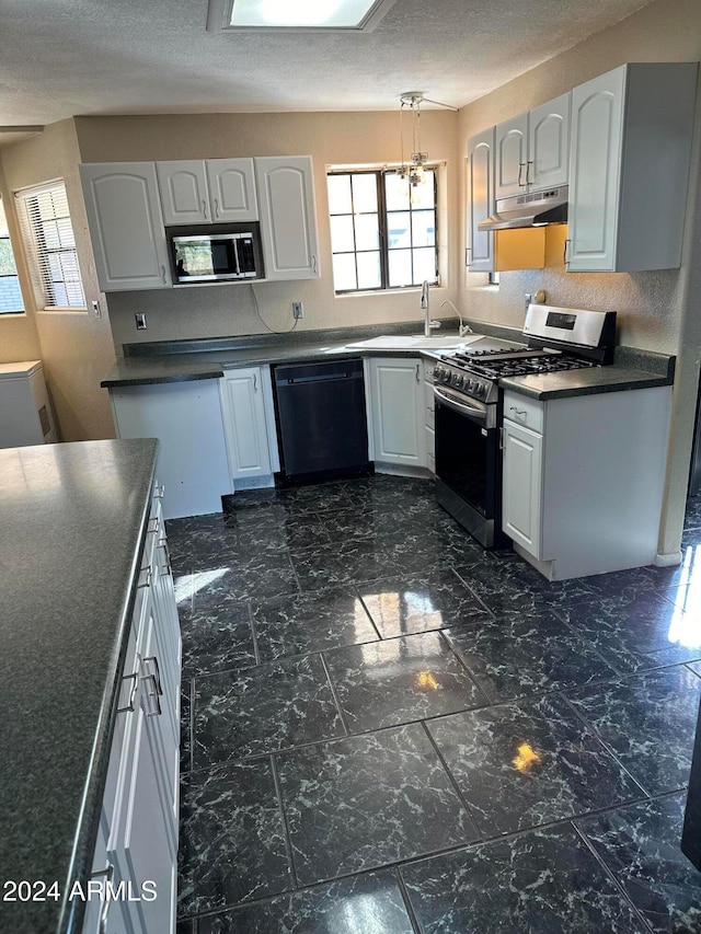 kitchen with white cabinetry, appliances with stainless steel finishes, hanging light fixtures, and sink