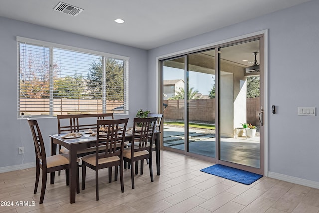 dining room featuring light hardwood / wood-style flooring and a healthy amount of sunlight