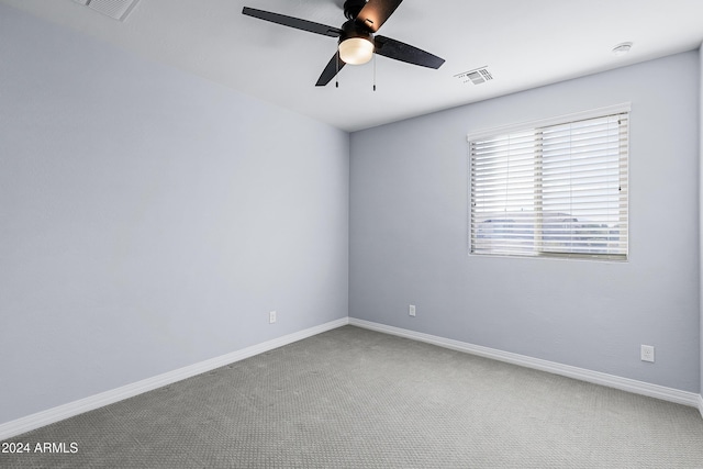 spare room with carpet flooring and ceiling fan