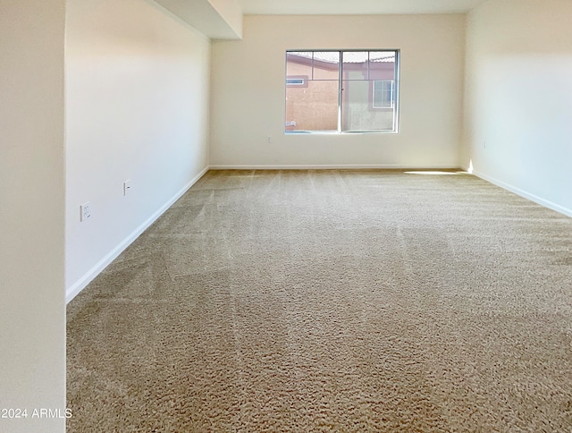 spare room with light colored carpet