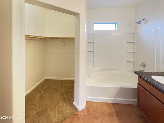 bathroom with shower / bathing tub combination, tile flooring, and vanity