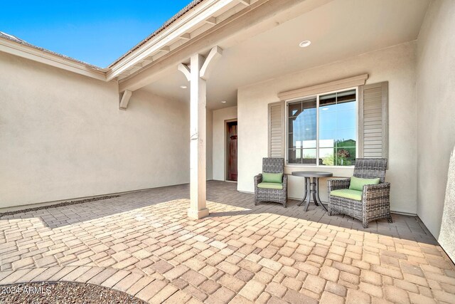 living room featuring ceiling fan, light hardwood / wood-style floors, and vaulted ceiling