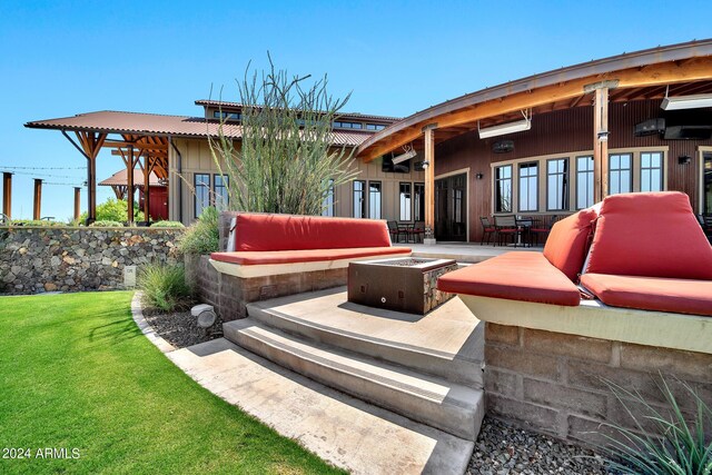 view of patio / terrace with an outdoor fire pit