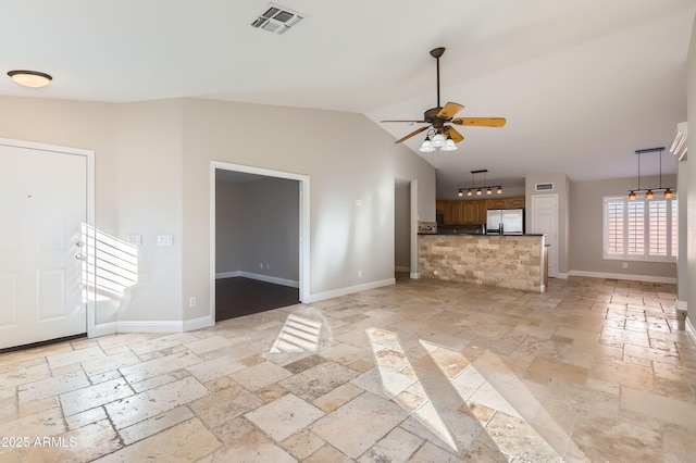 unfurnished living room featuring lofted ceiling and ceiling fan