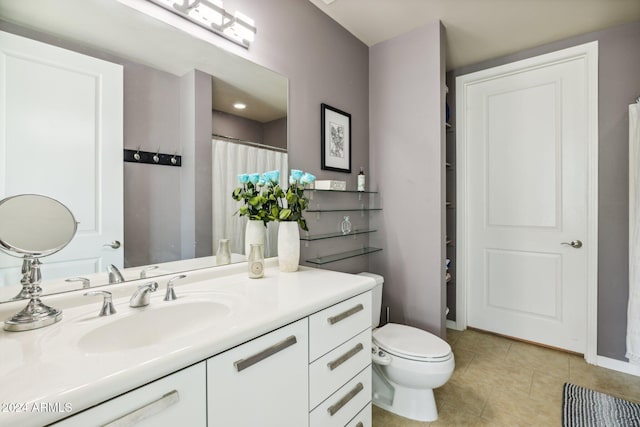 full bathroom featuring toilet, a shower with curtain, tile patterned flooring, and vanity