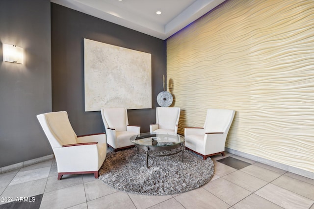 sitting room featuring baseboards, recessed lighting, and tile patterned flooring