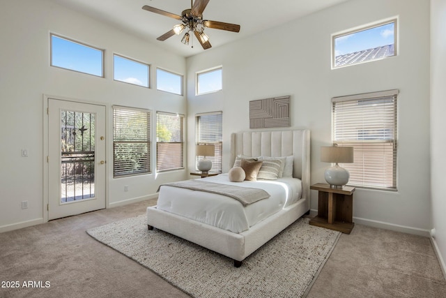 13680 E Paradise Dr, Scottsdale, AZ 85259 - bedroom with light carpet, a high ceiling, and baseboards