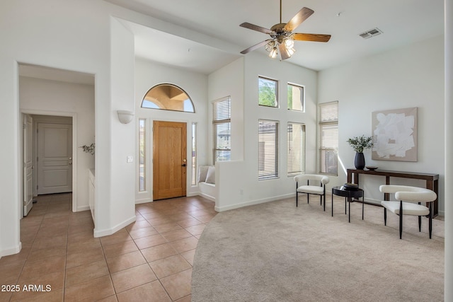 13680 E Paradise Dr, Scottsdale, AZ 85259 - entrance foyer featuring ceiling fan, light tile patterned floors, a towering ceiling, visible vents, and baseboards