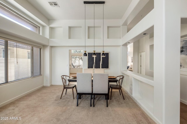 13680 E Paradise Dr, Scottsdale, AZ 85259 - carpeted dining room featuring visible vents, baseboards, plenty of natural light, and a high ceiling